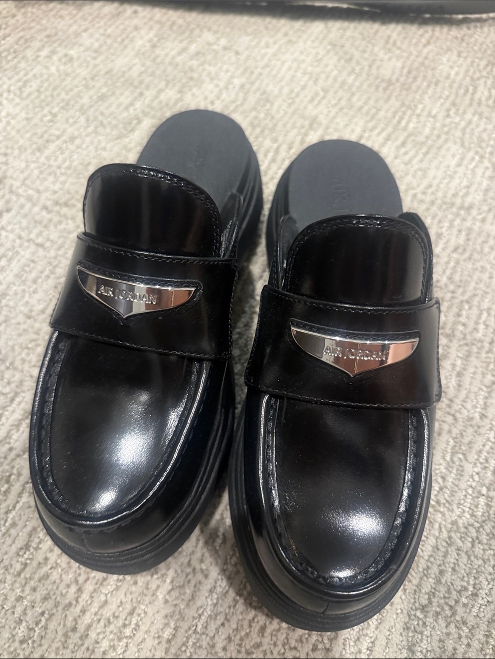 Jordan Black Patent Slip-On Loafers with Silver Emblem